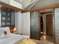 a bedroom with a bed and a closet